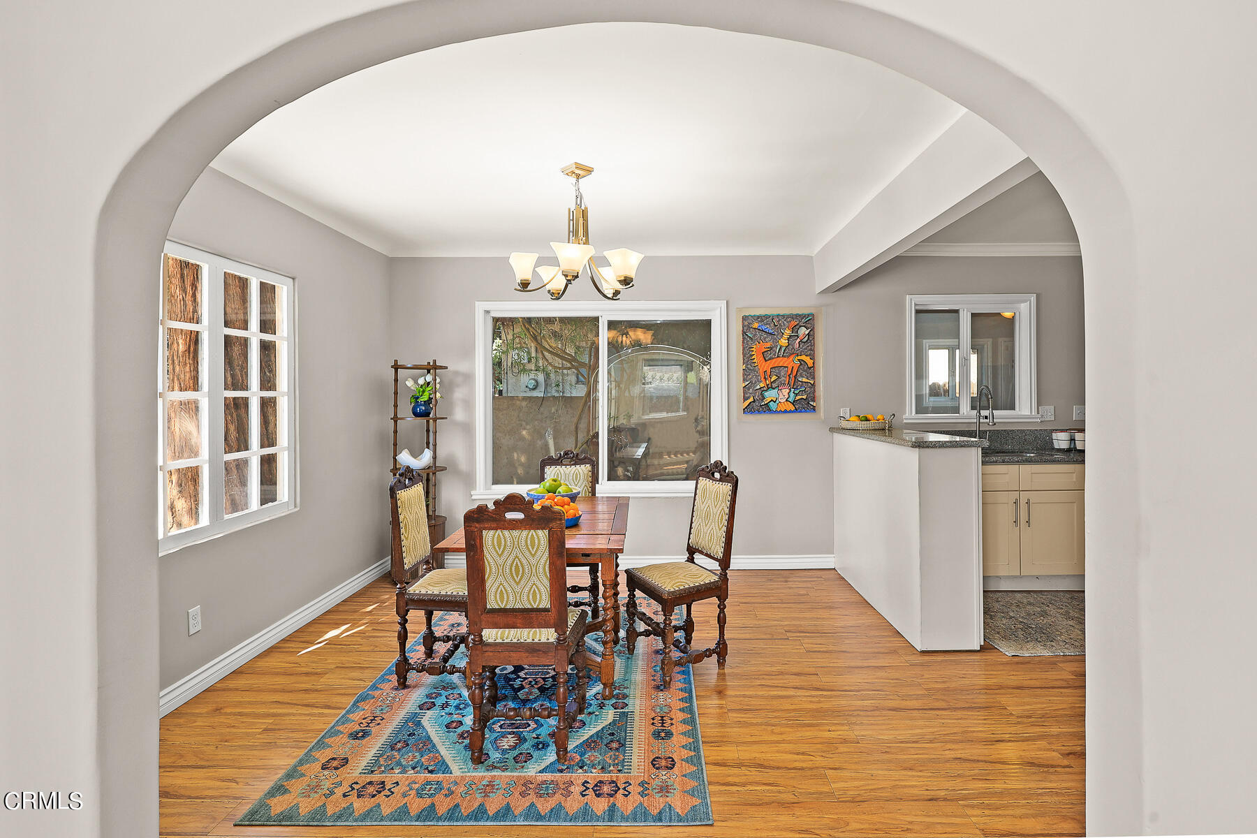 2116 Summit Avenue Altadena, CA 91001 - Photo 14 of 31 a dining room with wooden floor and chandelier