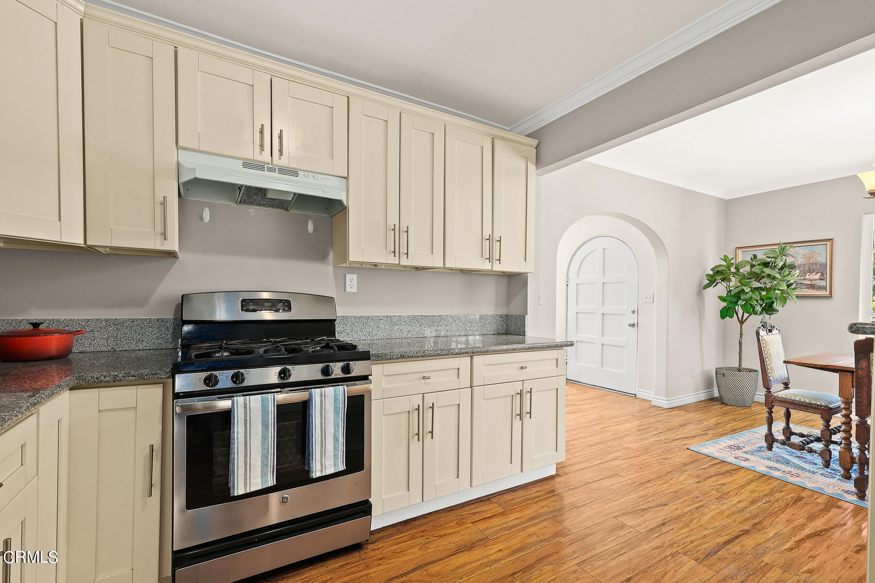 2116 Summit Avenue Altadena, CA 91001 - Photo 20 of 31 a kitchen with stainless steel appliances granite countertop a stove a sink and white cabinets
