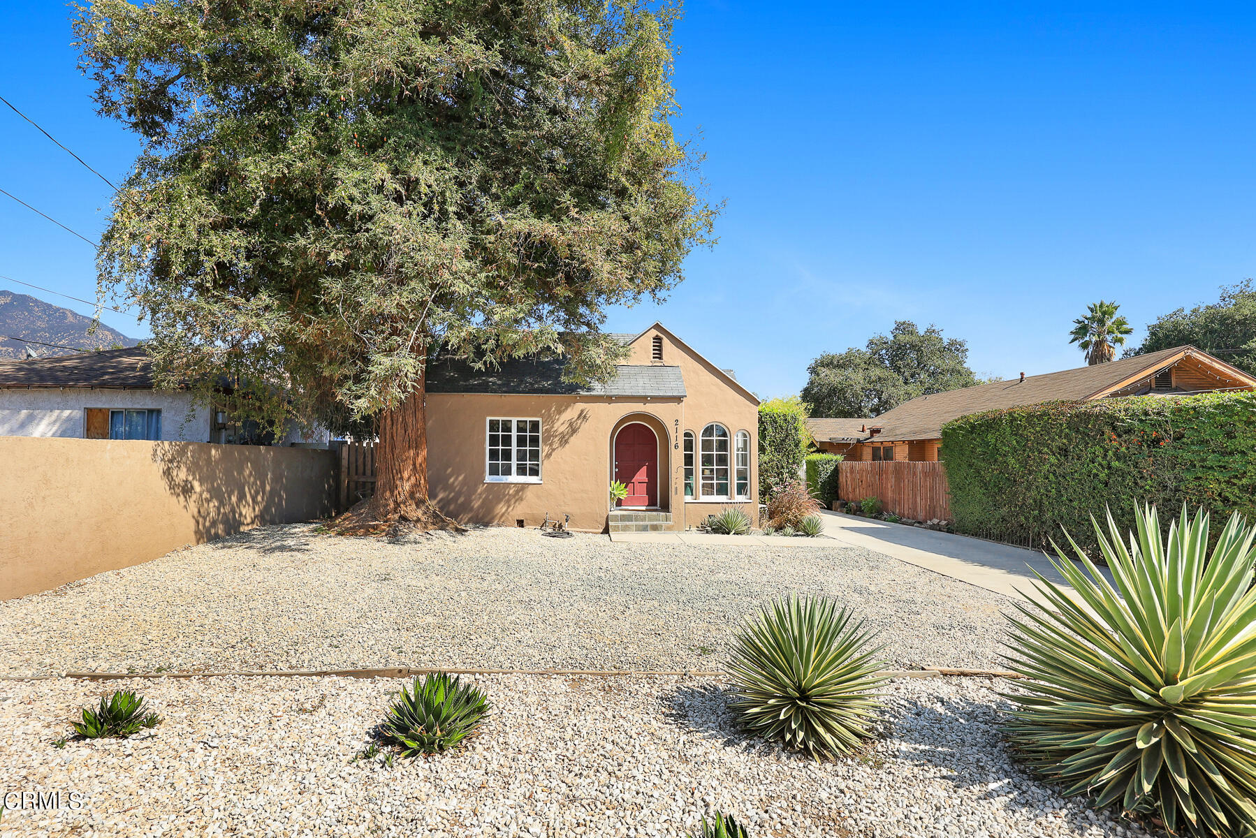 2116 Summit Avenue Altadena, CA 91001 - Photo 3 of 31 a front view of a house with a yard and garage