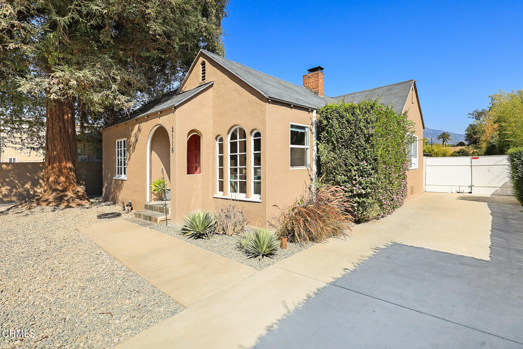 2116 Summit Avenue Altadena, CA 91001 - Photo 4 of 31 a front view of a house with a yard