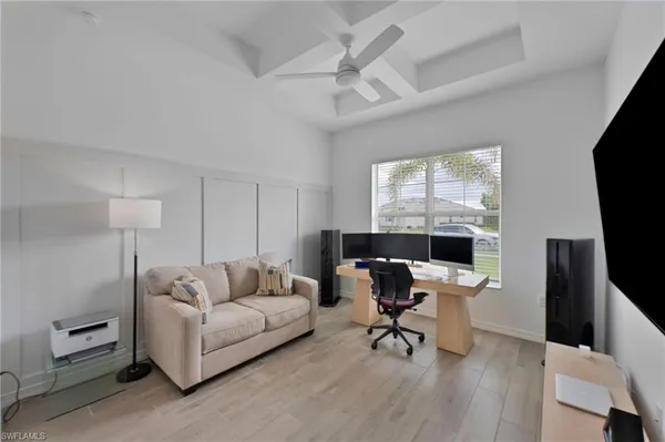 a kitchen with cabinets and chairs