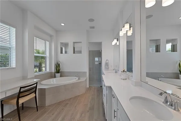 a bathroom with a sink toilet and a mirror