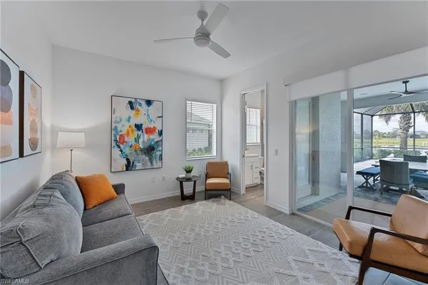 a living room with furniture and a large window