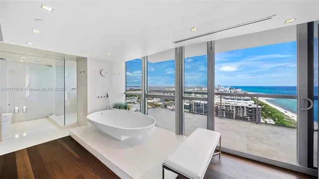 a bathroom with a sink mirror and toilet