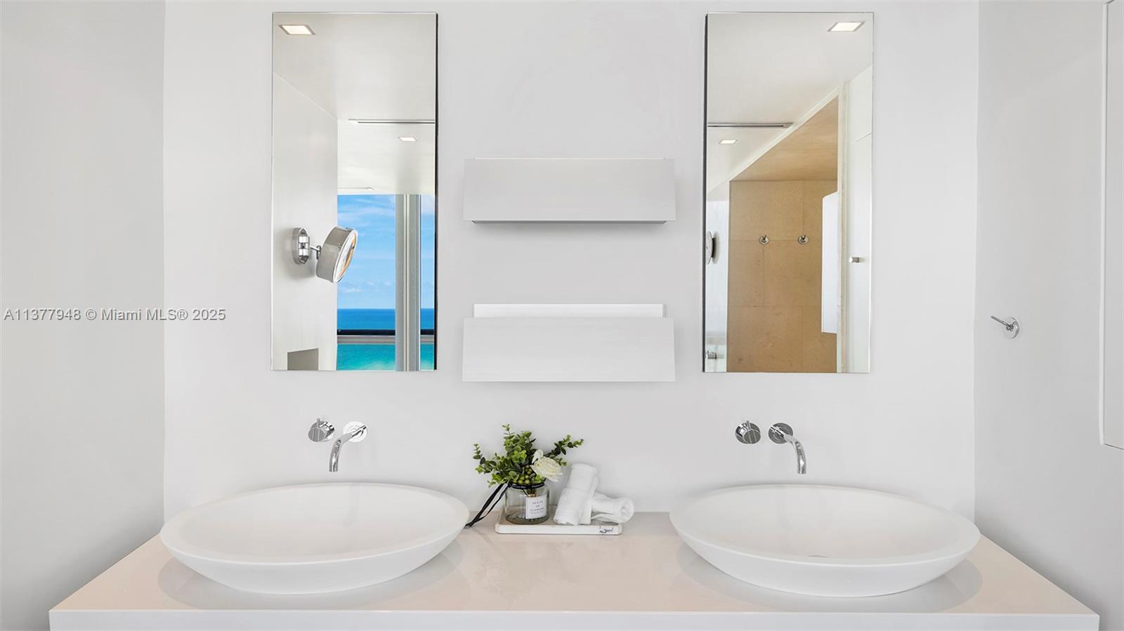 101 20th Street, Unit 3909 Miami Beach, FL 33139 - Photo 37 of 61 a bathroom with a granite countertop sink and a mirror