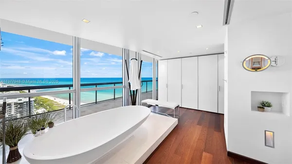 a white tub sitting in a bathroom