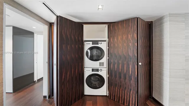 a bedroom with large window and a bed