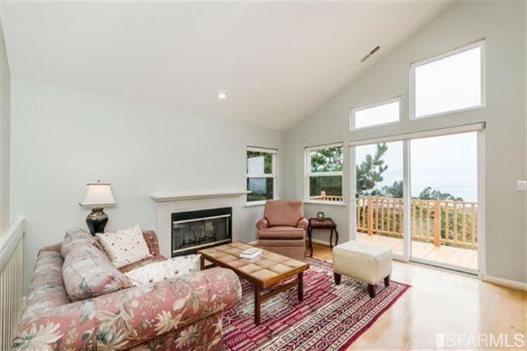 544 Monterey Road Pacifica, CA 94044 - Photo 7 of 10 a bedroom with furniture and a fireplace