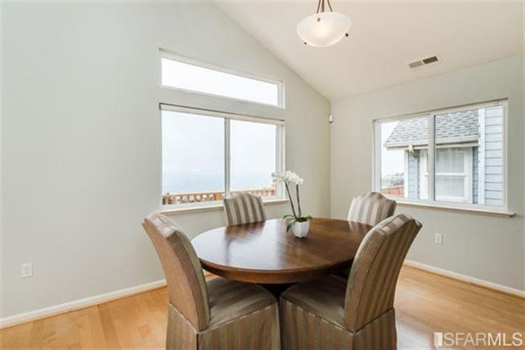 544 Monterey Road Pacifica, CA 94044 - Photo 9 of 10 a view of a dining room with furniture and window