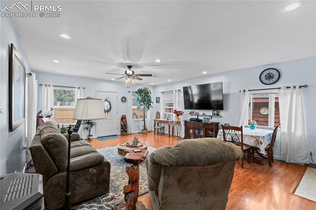 521 Brookside Street Colorado Springs, CO 80905 - Photo 11 of 27 a living room with furniture and a flat screen tv