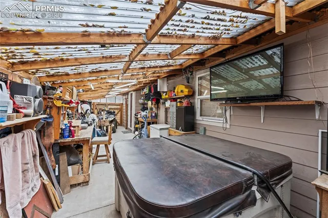a view of a room with wooden floor
