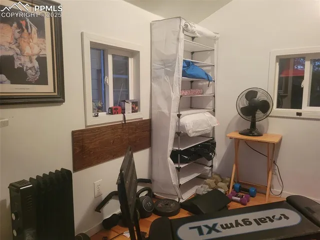 a living room with furniture and a piano