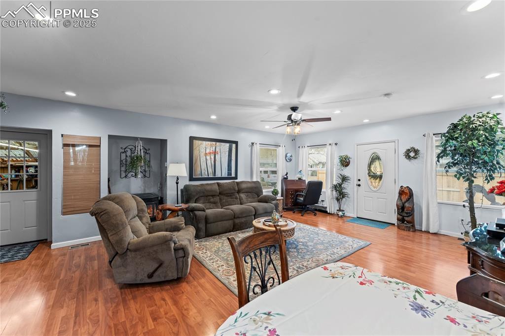 521 Brookside Street Colorado Springs, CO 80905 - Photo 10 of 27 a living room with furniture and a wooden floor