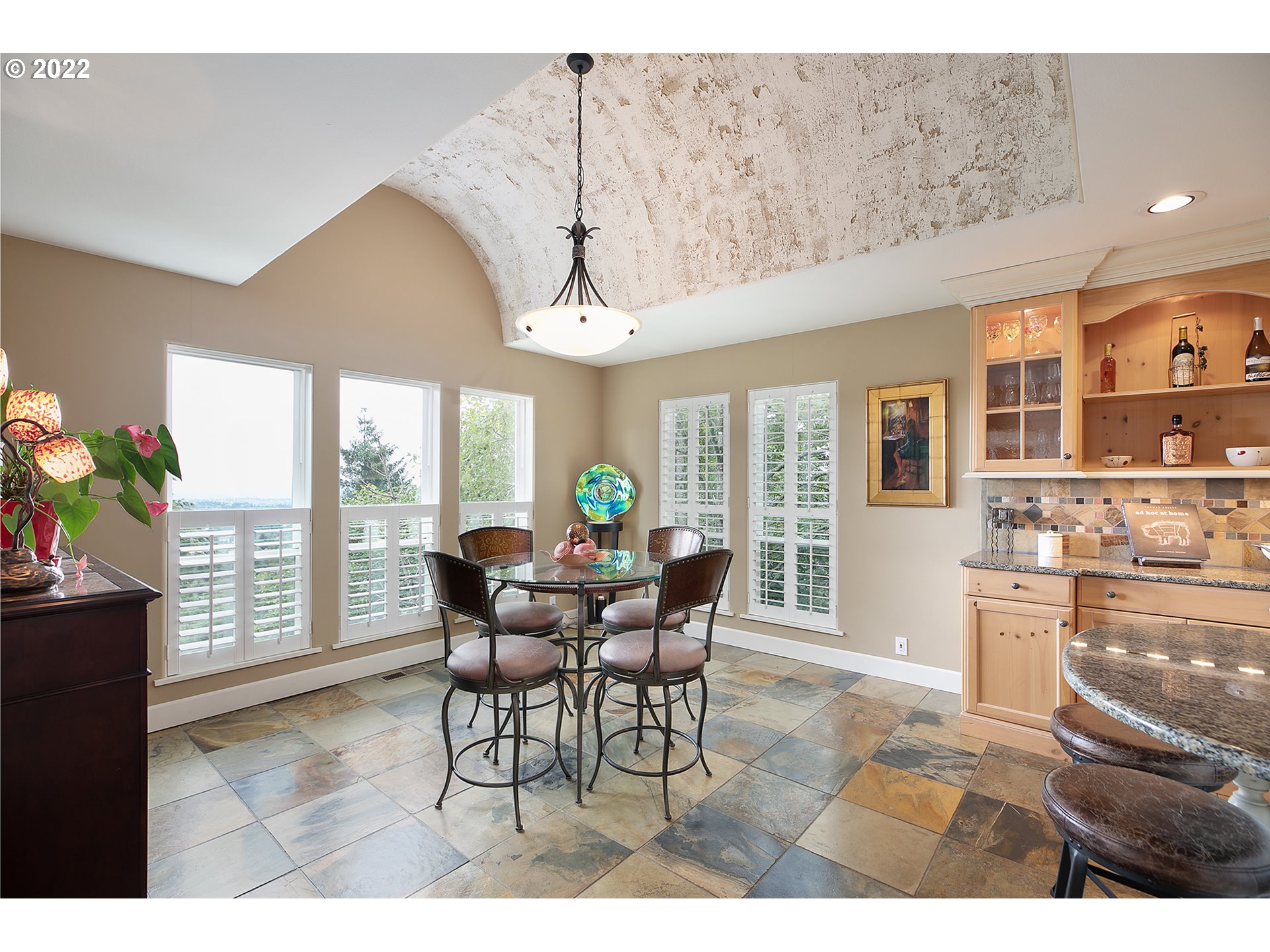 4027 Northwest Devoto Lane Portland, OR 97229 - Photo 14 of 48 a dining room with furniture and wooden floor