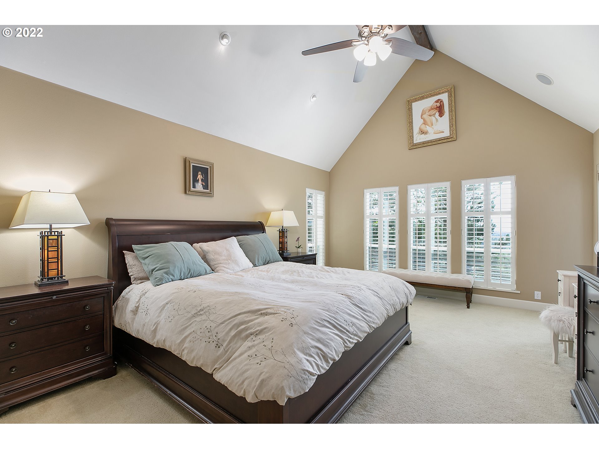 4027 Northwest Devoto Lane Portland, OR 97229 - Photo 16 of 48 a bedroom with a bed and a large window