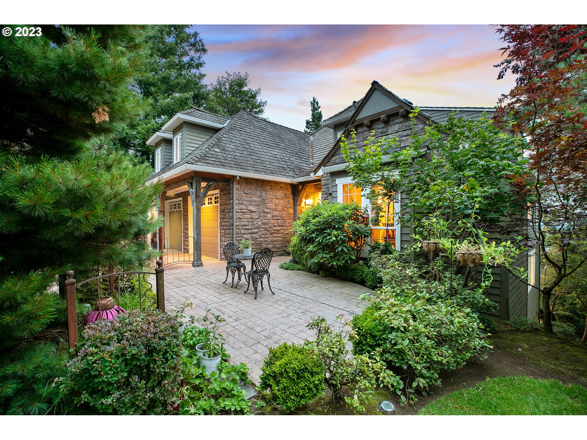4027 Northwest Devoto Lane Portland, OR 97229 - Photo 2 of 48 a view of a patio with table and chairs and potted plants