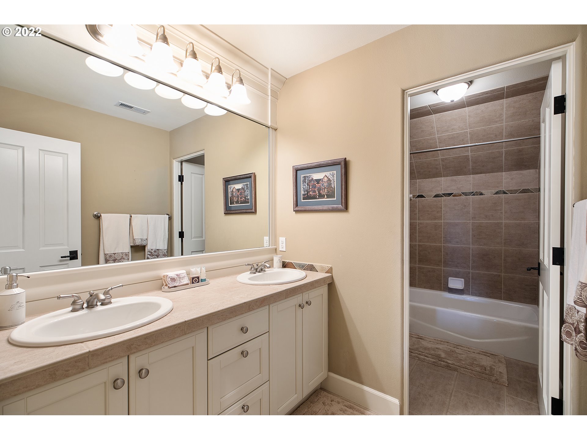 4027 Northwest Devoto Lane Portland, OR 97229 - Photo 26 of 48 a bathroom with a double vanity sink mirror and shower