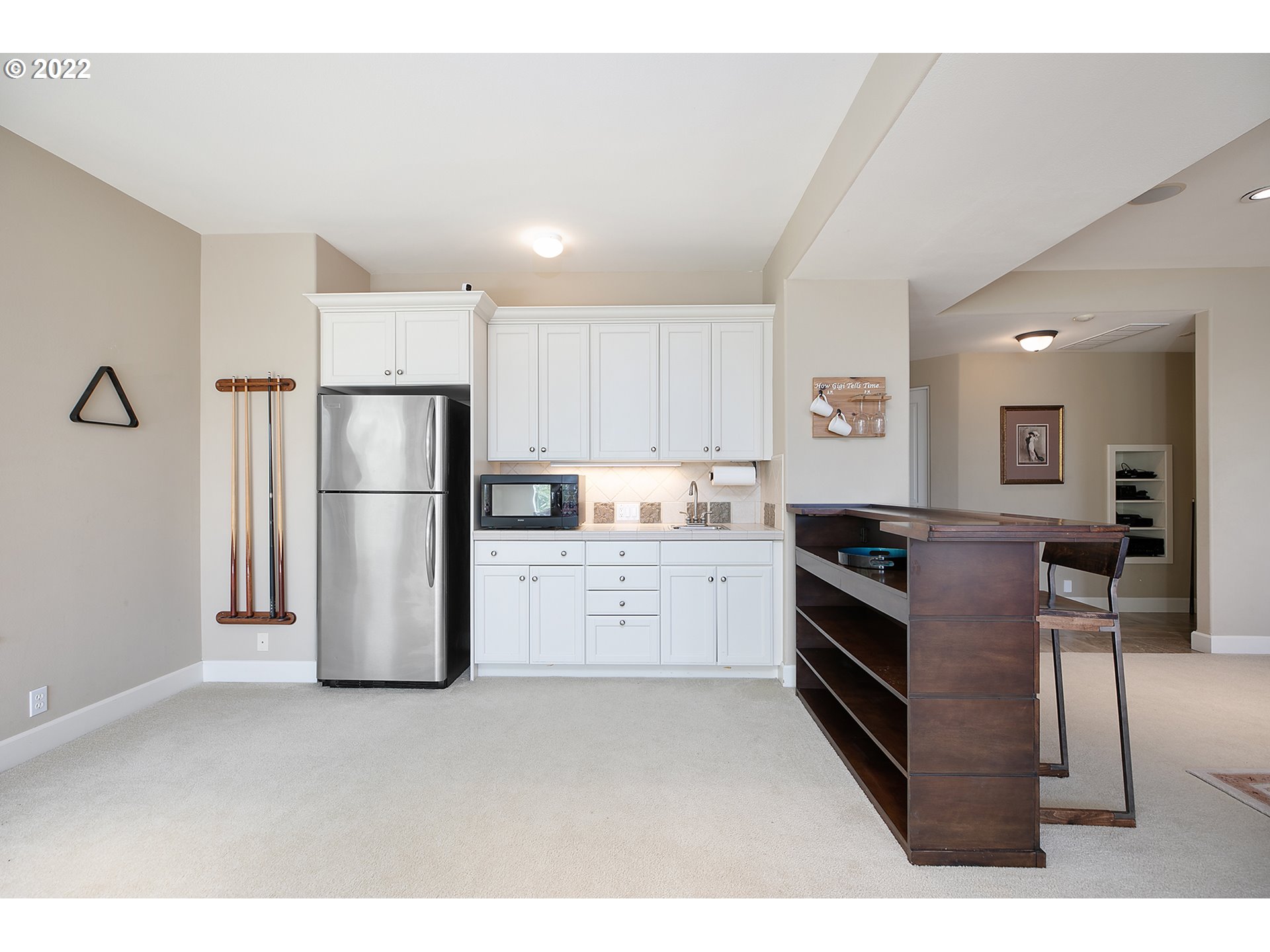 4027 Northwest Devoto Lane Portland, OR 97229 - Photo 31 of 48 a kitchen with refrigerator and cabinets