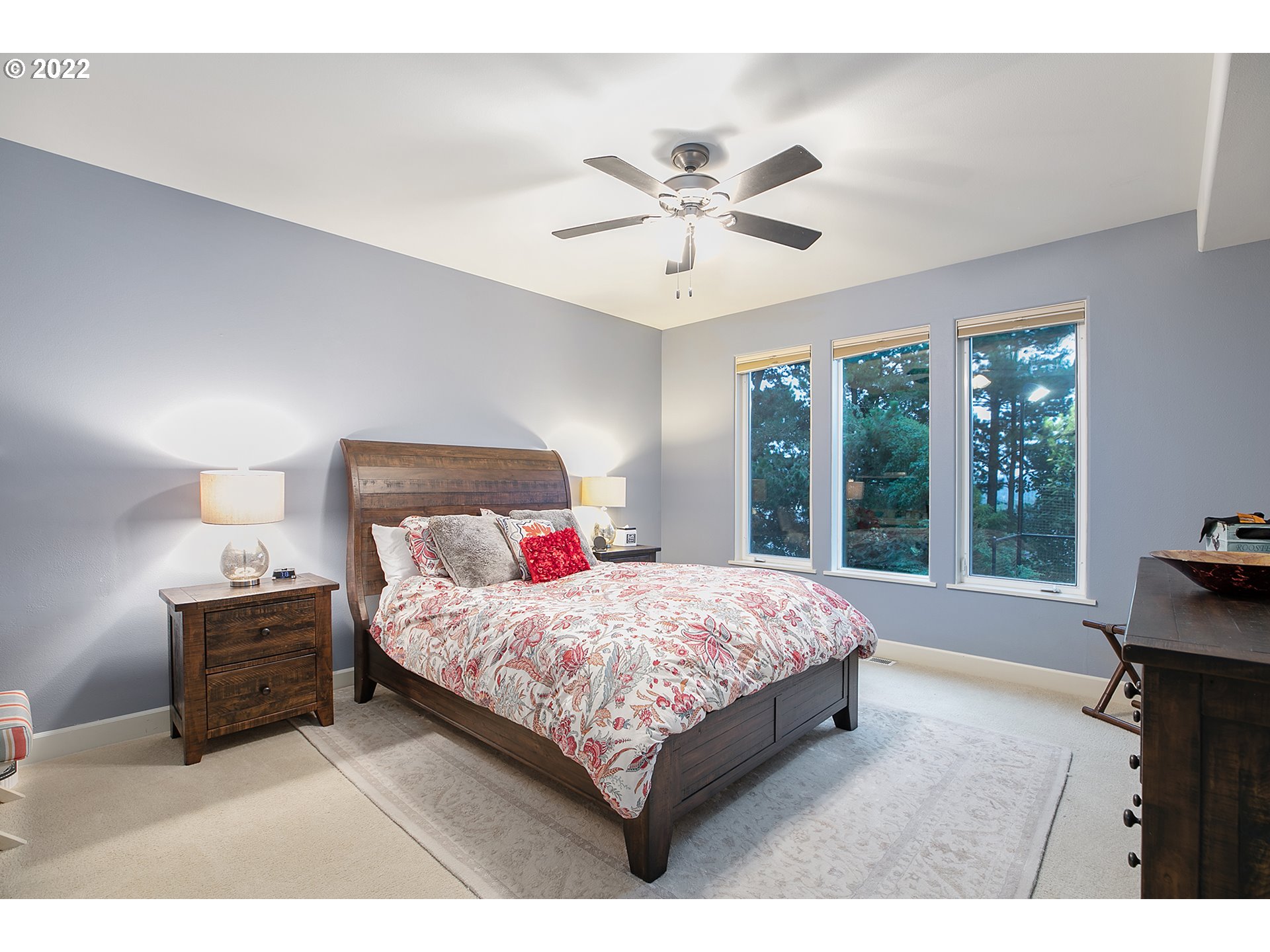 4027 Northwest Devoto Lane Portland, OR 97229 - Photo 35 of 48 a bedroom with a large bed and a window