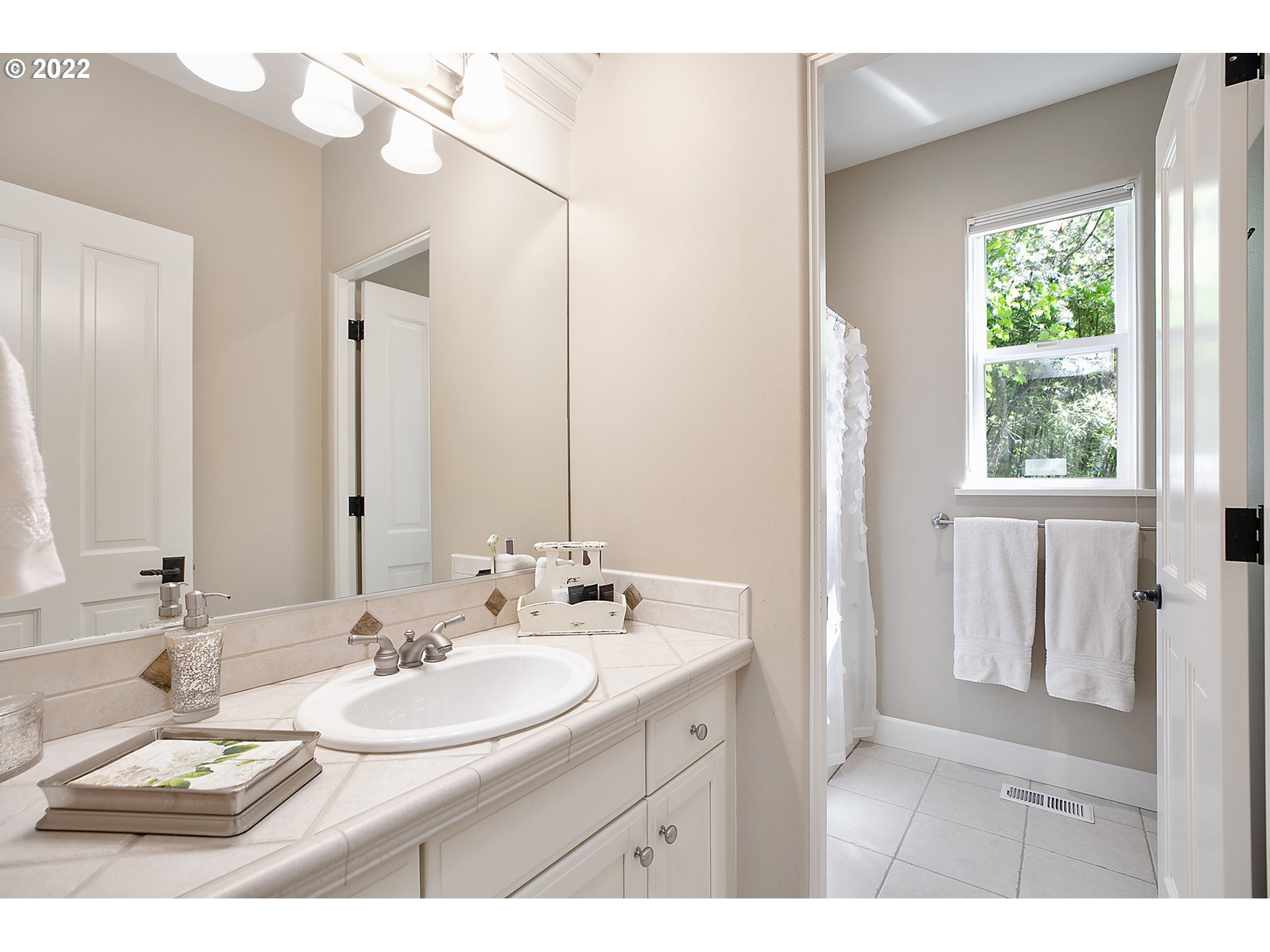 4027 Northwest Devoto Lane Portland, OR 97229 - Photo 36 of 48 a bathroom with a sink vanity granite and a mirror