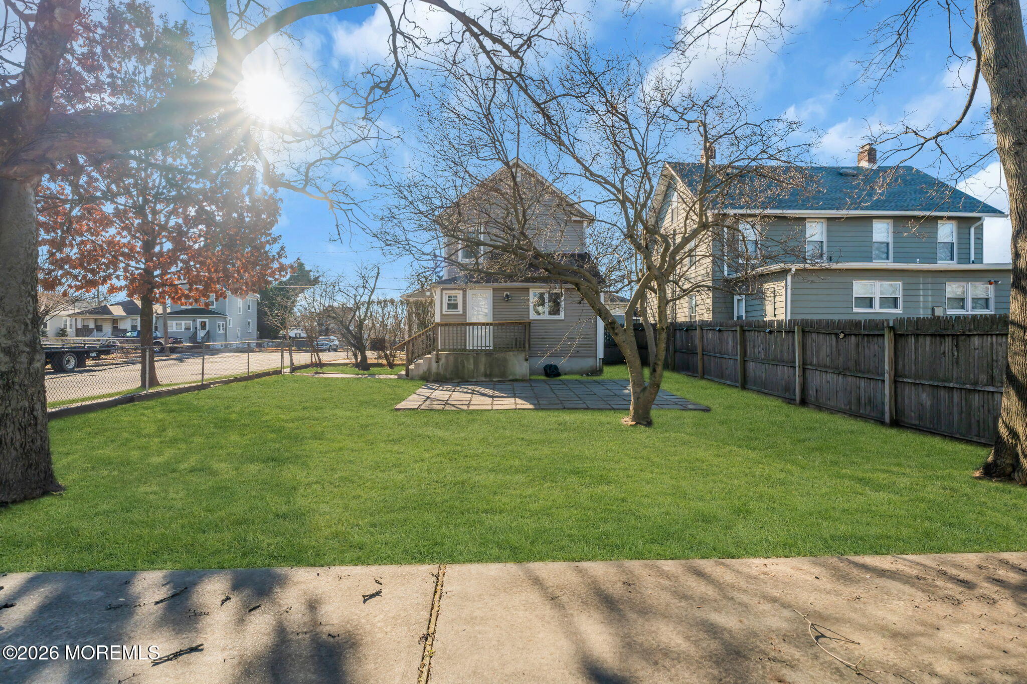 104 Bank Street Red Bank, NJ 07701 - Photo 14 of 16 a garden with trees in front of it