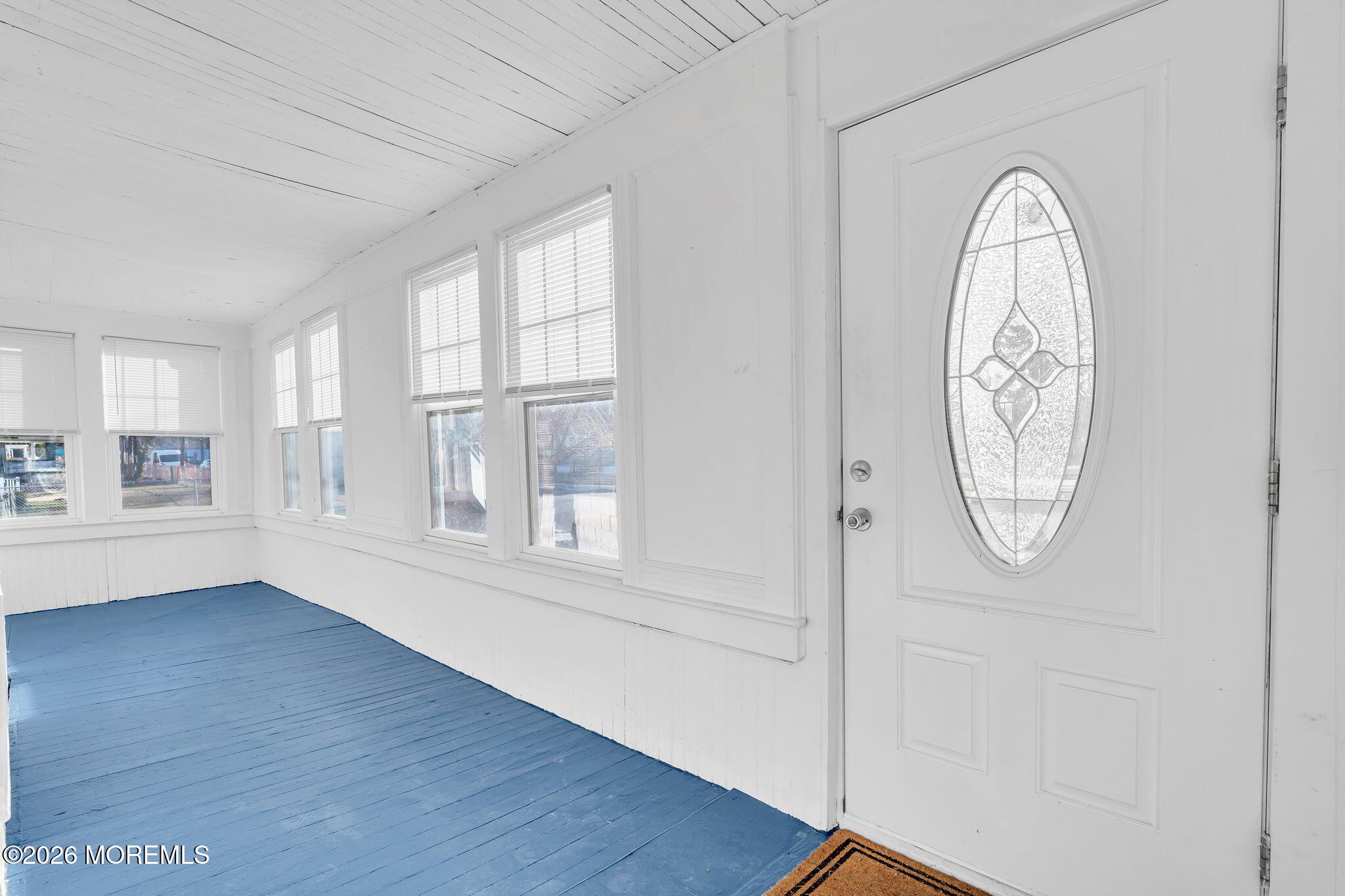104 Bank Street Red Bank, NJ 07701 - Photo 2 of 16 an empty room with wooden floor fan and windows