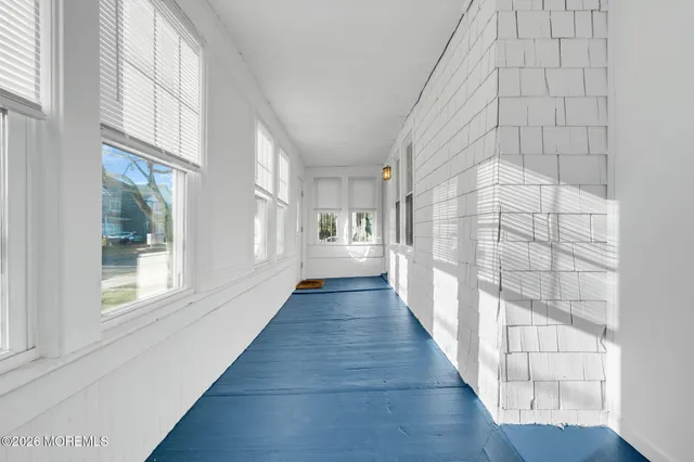 a view of an entryway with wooden floor