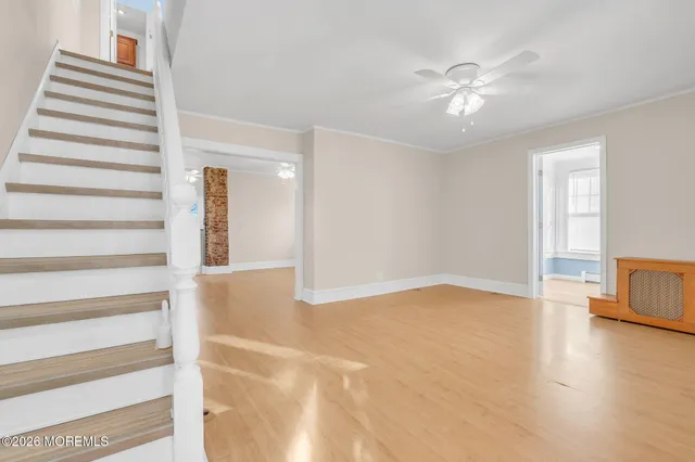 a view of an entryway with wooden floor