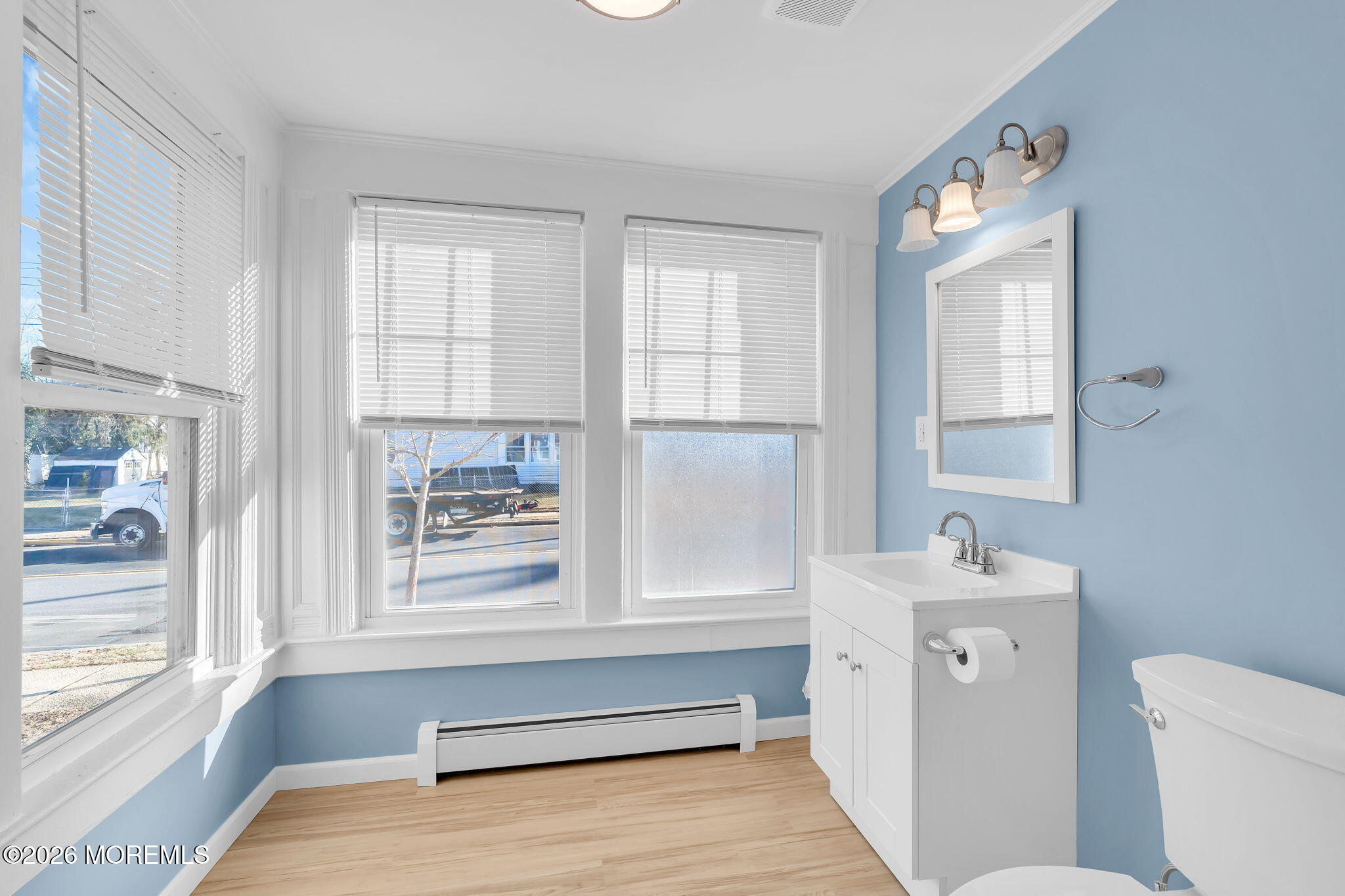 104 Bank Street Red Bank, NJ 07701 - Photo 9 of 16 a bathroom with a sink toilet and window