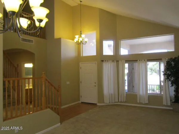 a view of a hallway with windows