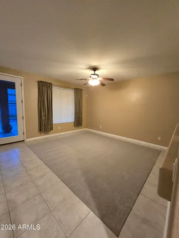 a view of a livingroom with a ceiling fan