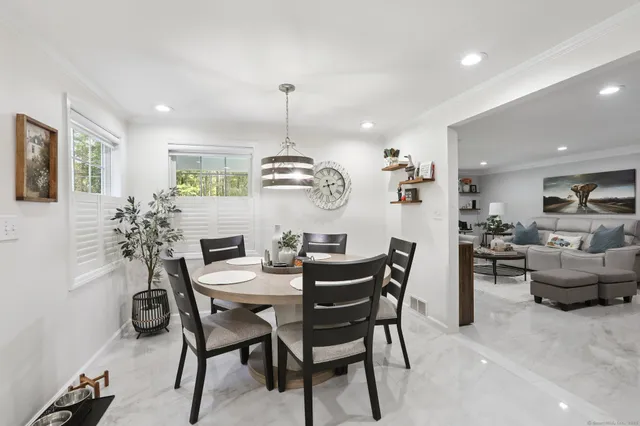 a view of a dining room with furniture