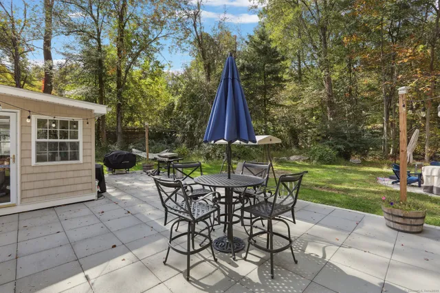 a view of backyard with furniture and garden
