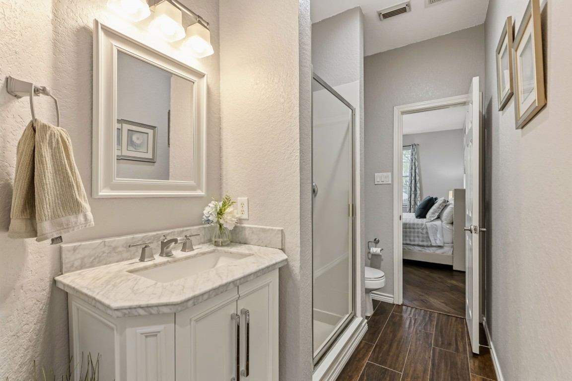 20102 Windbury Court Spring, TX 77379 - Photo 11 of 49 The downstairs bathroom has a shower and connects to the downstairs bedroom.