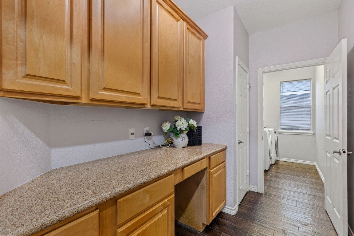 20102 Windbury Court Spring, TX 77379 - Photo 12 of 49 The butler's pantry is right off the kitchen. The utility room is just beyond it.