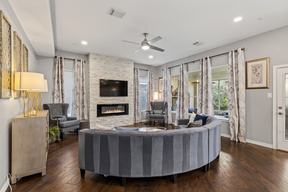 20102 Windbury Court Spring, TX 77379 - Photo 49 of 49 This electric fireplace in the family room provides warmth and coziness! This view is from the kitchen - the floorplan is very open.