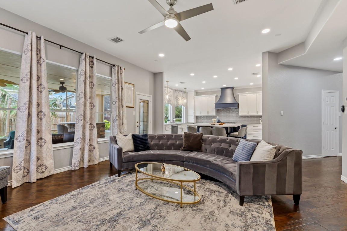 20102 Windbury Court Spring, TX 77379 - Photo 13 of 49 The family room has a lovely view into the cozy screened in patio and the custom kitchen.