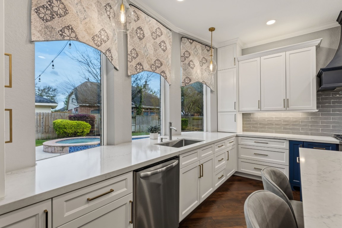 20102 Windbury Court Spring, TX 77379 - Photo 15 of 49 The view from the kitchen windows looks out over the backyard and the pool.