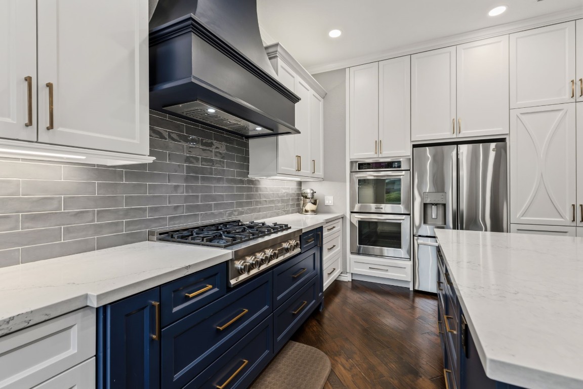 20102 Windbury Court Spring, TX 77379 - Photo 16 of 49 The kitchen has a 6-burner Zline gas cooktop and Kitchen Aid double ovens. Look at all that counterspace!