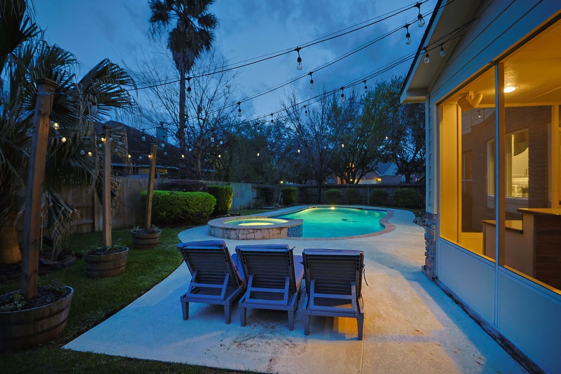 20102 Windbury Court Spring, TX 77379 - Photo 29 of 49 This patio, just outside the screened patio, provides a place to relax poolside.