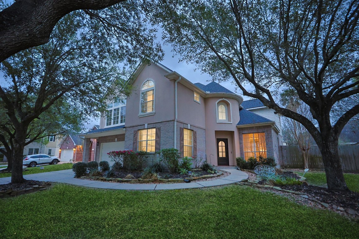20102 Windbury Court Spring, TX 77379 - Photo 3 of 49 An evening view of the beautiful facade.