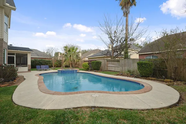 a view of pool with outdoor seating