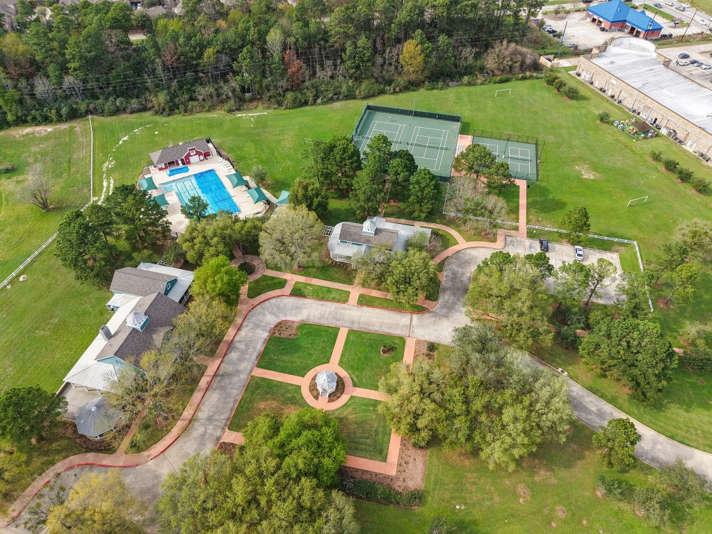 20102 Windbury Court Spring, TX 77379 - Photo 39 of 49 Here you can see a pool, some tennis and pickleball courts, as well as a meeting house and some green spaces.