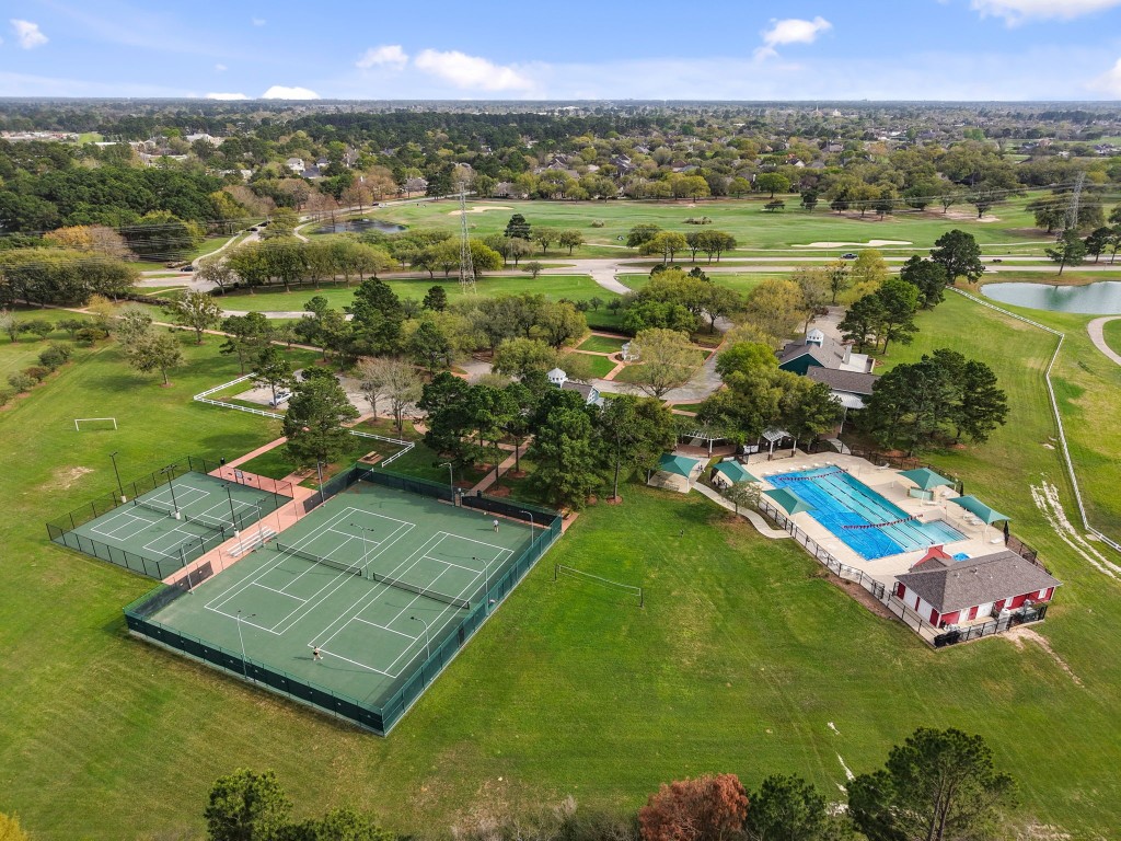20102 Windbury Court Spring, TX 77379 - Photo 40 of 49 Look how gorgeous and well-maintained the community of Windrose is! This is the Eagle Bend competition-sized pool, and there are also tennis courts, pickle ball courts, and a large playground.