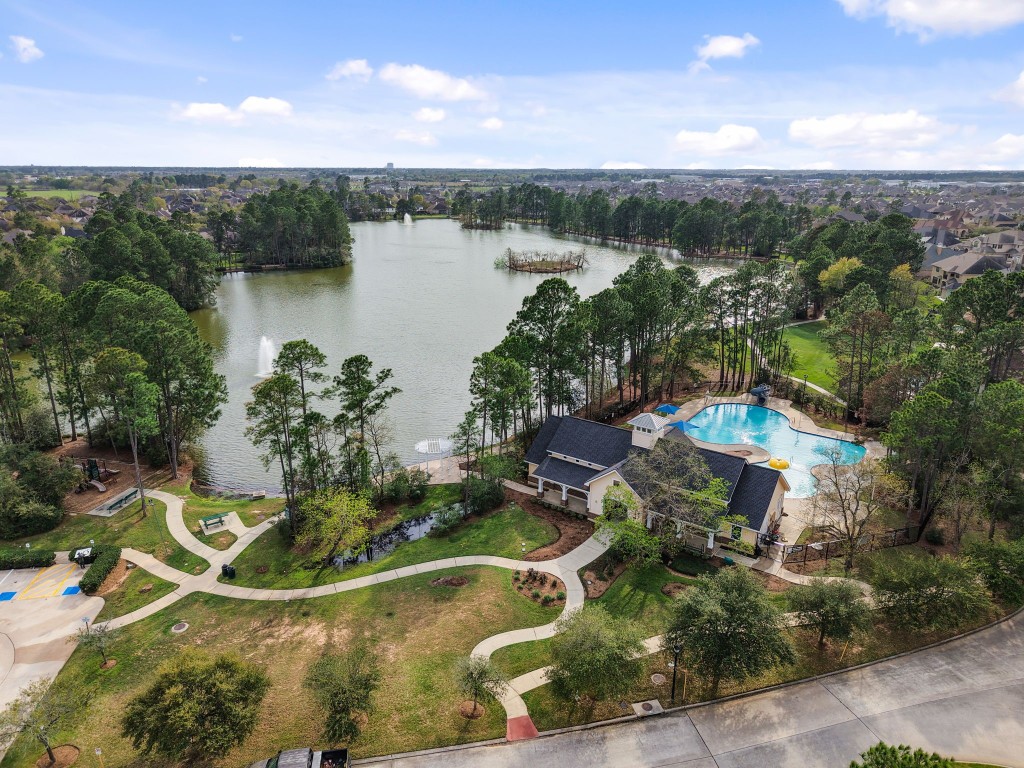 20102 Windbury Court Spring, TX 77379 - Photo 43 of 49 Windrose community has stunning amenities. This is the lake with the dedicated walking trails,and there is also a fun pool, a clubhouse, and a playground.