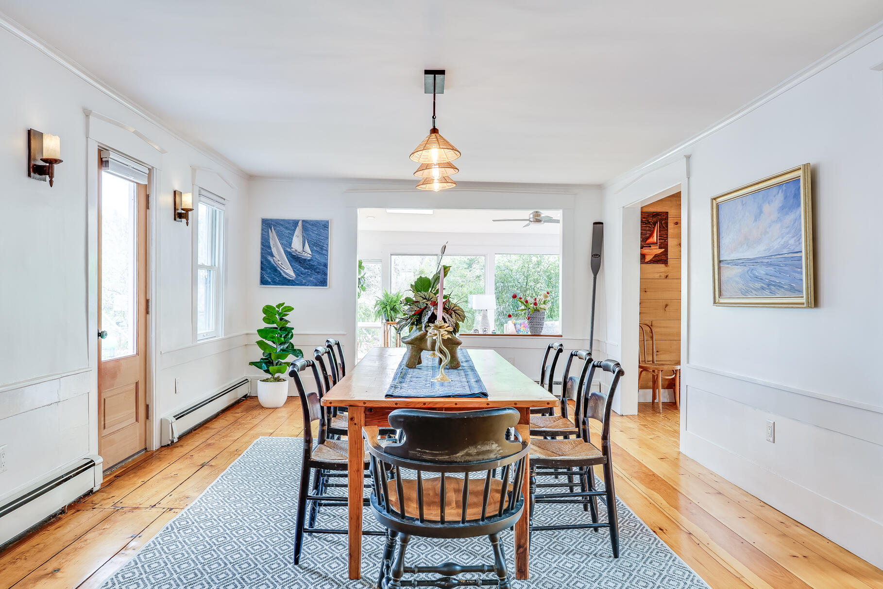 2147 Route 6 Wellfleet, MA 02667 - Photo 14 of 98 a view of a dining room with furniture window and wooden floor