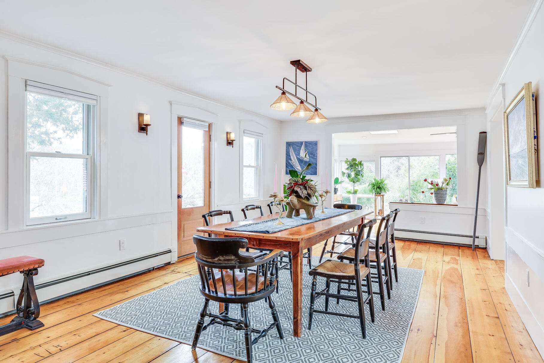 2147 Route 6 Wellfleet, MA 02667 - Photo 16 of 98 a view of a dining room with furniture and wooden floor