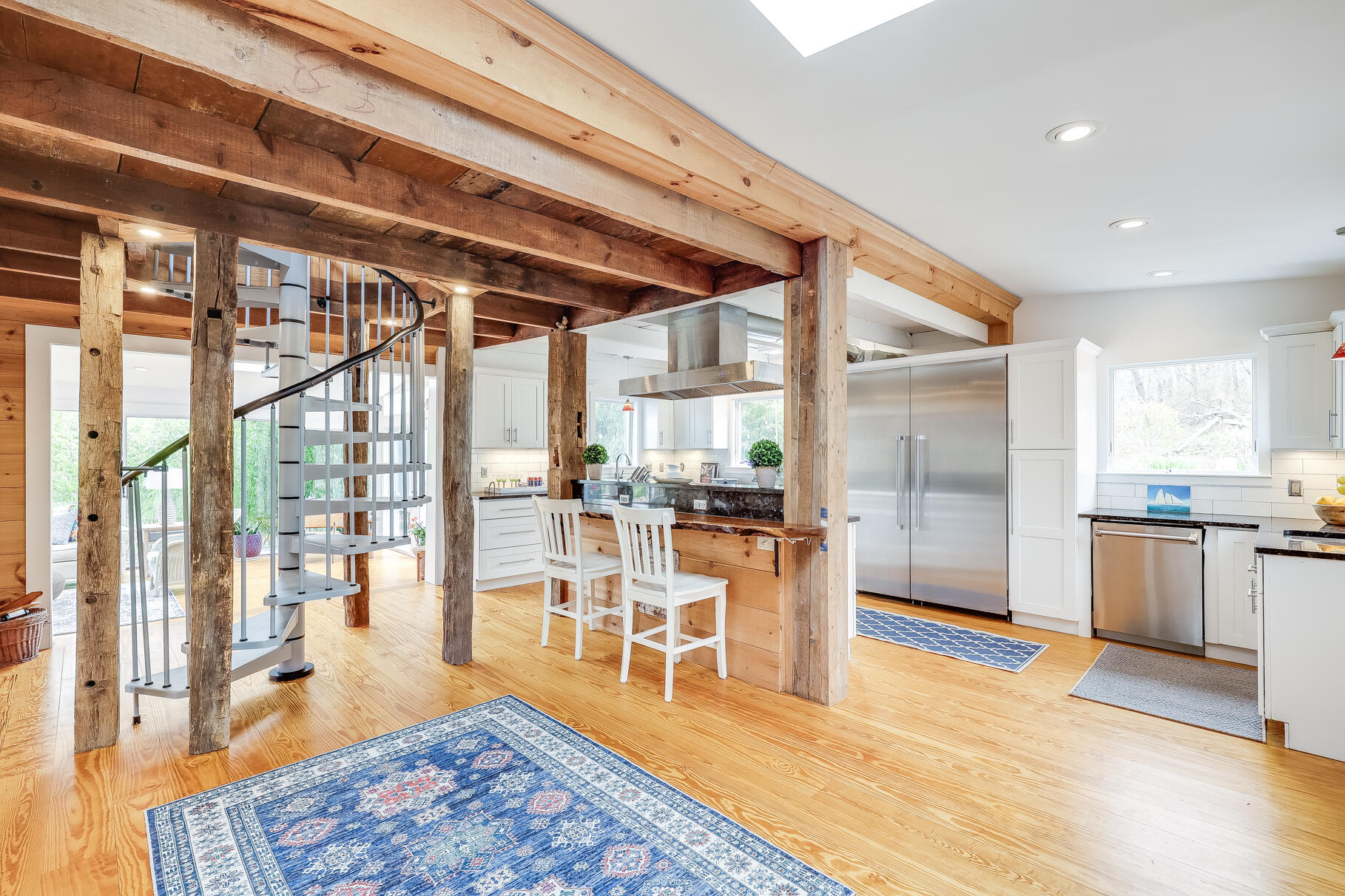 2147 Route 6 Wellfleet, MA 02667 - Photo 20 of 98 a living room with stainless steel appliances granite countertop a couch wooden floor and a table