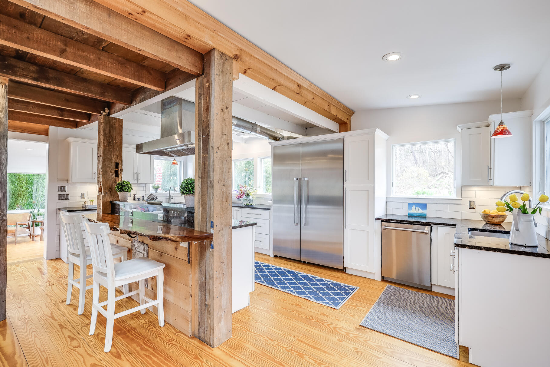 2147 Route 6 Wellfleet, MA 02667 - Photo 25 of 98 a kitchen with stainless steel appliances granite countertop a refrigerator and a stove top oven