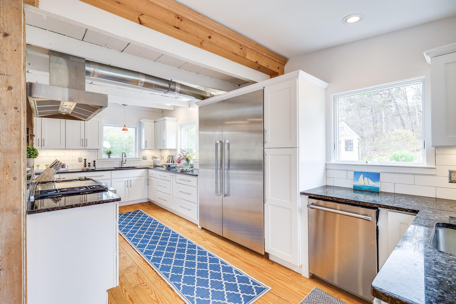 2147 Route 6 Wellfleet, MA 02667 - Photo 30 of 98 a kitchen with stainless steel appliances granite countertop a refrigerator and a sink